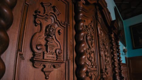 Close-up-of-intricate-wooden-carvings-on-a-panel-in-Trakošćan-Castle's-dining-room