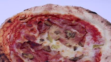 Italian-Pizza-with-ham,-mozzarella-cheese-and-mushrooms