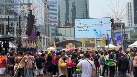 People-have-a-great-time-water-fighting-during-the-celebration-of-the-Songkran-Festival-at-Central-World,-Bangkok,-Thailand