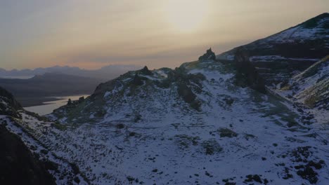 Old-Man-of-Storr-and-snow-blanketed-Highlands-of-the-Isle-of-Skye