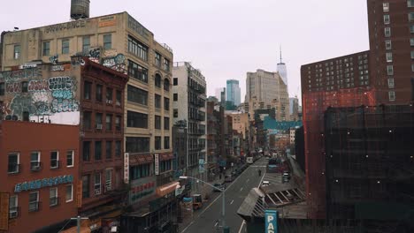 Chinatown-In-NYC-Looking-At-Freedom-Tower-In-Lower-Manhattan-View-From-Bridge-Pan-Up