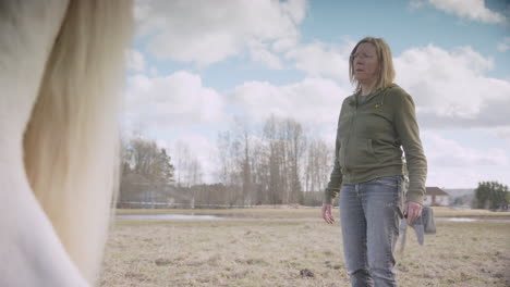 Swedish-woman-shakes-limbs-loose-to-open-up-emotionally-during-equine-therapy