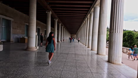 Beautiful-summer-girl-walking-in-Museum-of-the-Ancient-Agora-in-Athens