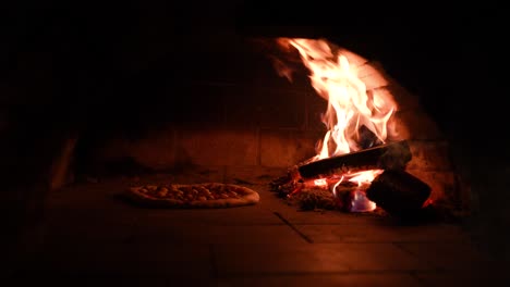 Static-shot-of-Traditional-way-baked-wood-fired-oven-with-Italian-pizza