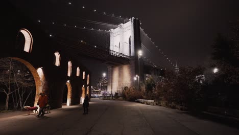 Woman-looking-at-old-architecture-next-to-Brooklyn-Bridge