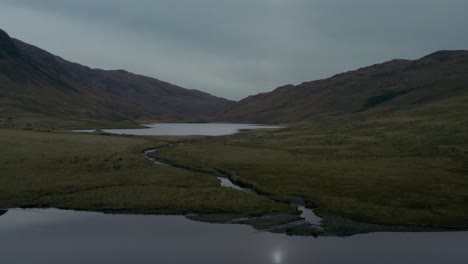 Scenic-flight-over-Scottish-Highlands-and-Loch,-Isle-of-Mull,-Scotland