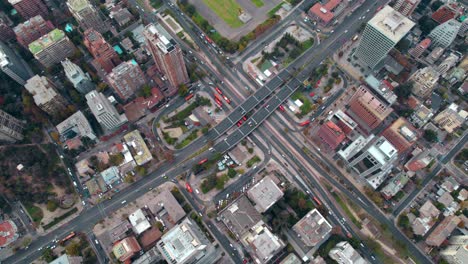 Escuela-militar-subway-station-and-surrounding-cityscape-during-the-day,-aerial-view