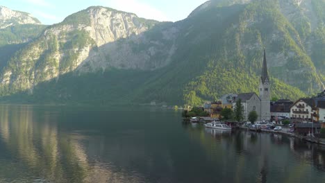 Peaceful-Evening-in-Hallstatt-Village-with-Ferry-in-Pier