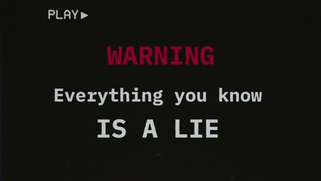 Reconstructed-fake-VHS-tape-capture-contains-a-warning-text-message:-everything-you-know-is-a-lie