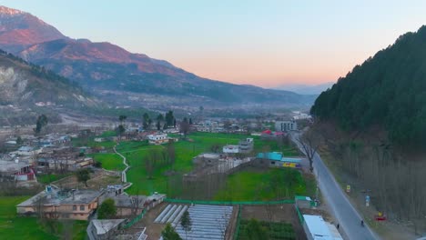 Forward-drone-view-of-cityscape-of-Balakot-during-sunrise-in-Pakistan