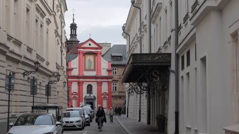 SLOW-MOTION,-Women-on-the-bicycle-is-in-the-Krakow-city-centre,-Poland