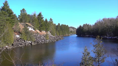 Stream-flows-in-slow-motion-through-a-mountain-landscape