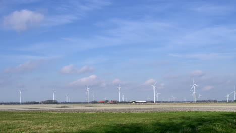 Windturbines-in-an-agricultural-field-in-the-Netherlands,-Europe