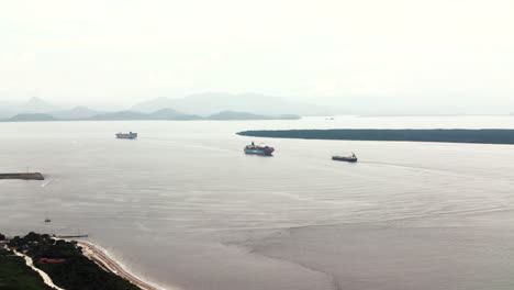 Cargo-ships-sailing-to-the-port-of-Paranagua,-main-bulk-export-port,-Brazil