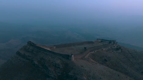 Drone-flight-at-ranikot-fort-in-sindh-pakistan-over-historical-ruins-at-fogy-weather