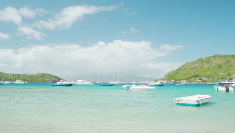 Small-boats-docked-in-clear-water-in-bright-sunlight-in-Guadeloupe