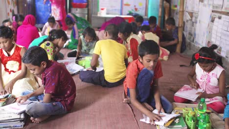 A-group-of-poor-child-reading-in-a-school-of-Bangladesh