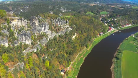 Aerial-Reveal-Rock-Massif-Bastei-Above-Elbe-River-In-The-Saxon-Switzerland-National-Park-In-Germany