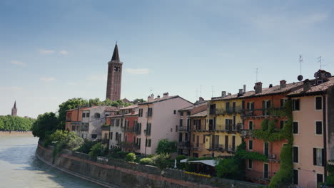 Sunny-day-in-Verona,-Italy,-with-historic-buildings-along-Adige-River