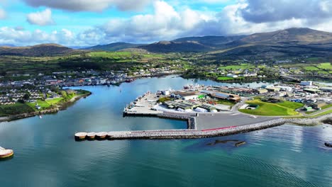 Drone-static-of-Castletownbere-harbour-and-town,-working-fishing-harbour-and-tourism-town-on-the-Wild-Atlantic-Way-in-west-Cork-Ireland-on-a-summer-day