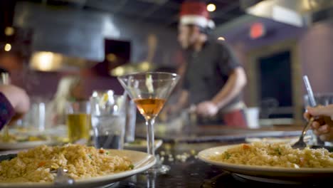 Point-of-view,-guests-enjoying-their-night-out-at-a-hibachi-cuisine-restaurant