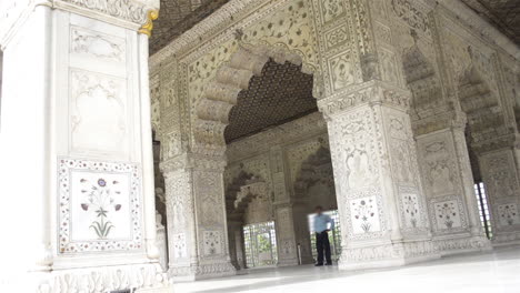 Guard-standing-at-beautiful-ancient-white-marble-interiors-architectures-of-red-fort-delhi