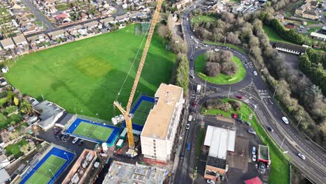 Ascending-drone,aerial--tower-crane-on-building-site-UK