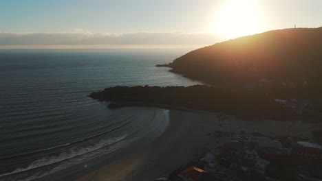 Aerial-view-of-the-sunset-over-the-beach-in-Barra-Da-Lagoa