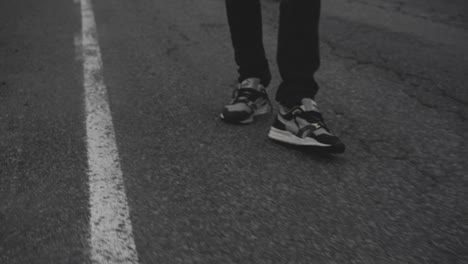 SlowMotion-footage-of-skater-doing-his-thing-on-icelandic-roads,-in-a-foggy,-dramatic-landscape