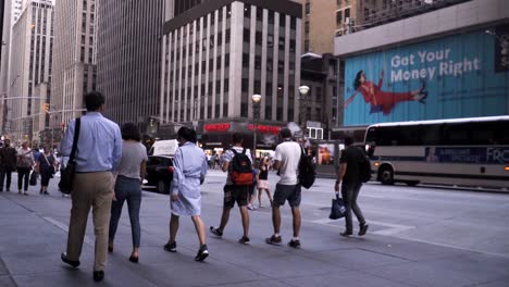 People-walking-together-in-New-York-City-on-Manhattan-near-Rockefeller-Center-during-the-day-in-slow-motion