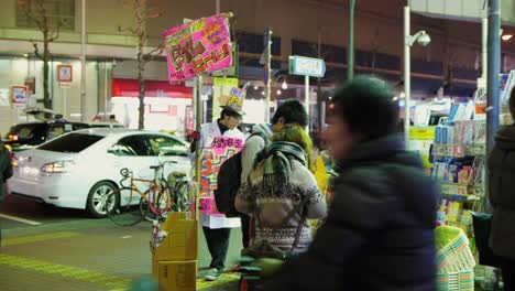 Front-view-of-a-comic-store-in-Japan,-colorful-at-night