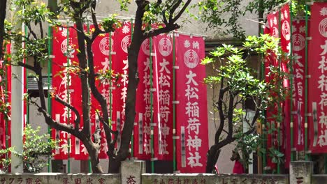 Close-up-view-of-a-little-japanese-shrine-in-city