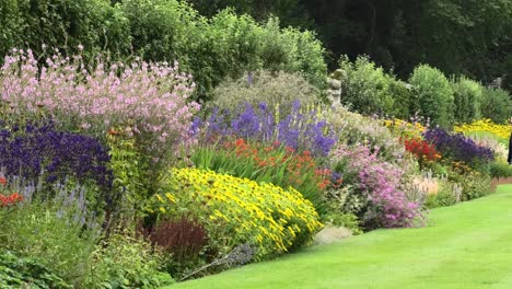 The-herbaceous-border-at-Pitmedden-garden-with-a-group-of-tourists-admiring-it