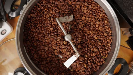 Coffee-Beans-Roasting-Spinning-In-Roaster-Machine-Tray,-Top-Down-View