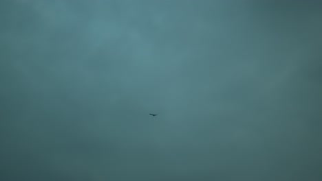 Mysterious-object-flying-under-an-overcast-sky,-hinting-at-unidentified-phenomena