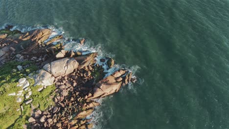 Beautiful-aerial-landscape-of-waves-crashing-on-rocky-coastline-of-Barra-Da-Lagoa,-Santa-Catarina,-Florianópolis,-Brazil