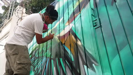 Graffiti-Artist-Eldakpak-Painting-A-Fence-In-Downtown-Mexico-1