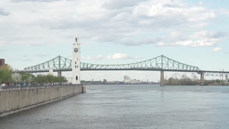 aerial-established-of-the-Montreal-Jacques-Cartier-Bridge-and-Clock-Tower-during-a-sunny-day,-quebec-Canada