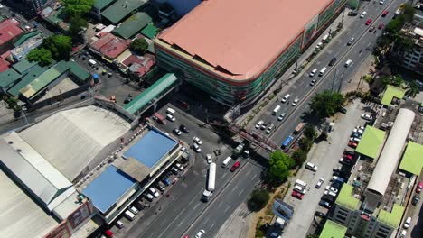 An-aerial-tracking-shot-following-a-tanker-as-it-blocks-traffic-then-revealing-the-urban-jungle-and-bridge-it-is-about-to-cross