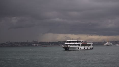 At-the-Kadıköy-pier,-in-cloudy-weather,-ships-are-sailing,-birds-are-flying,-on-the-Bosphorus