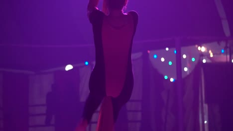 A-flexible---healthy-acrobat-perform-in-the-air-at-a-circus