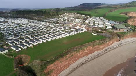 Aerial-shot-of-the-vast-caravan-holiday-park-at-Ladram-Bay-near-Sidmouth,-Devon