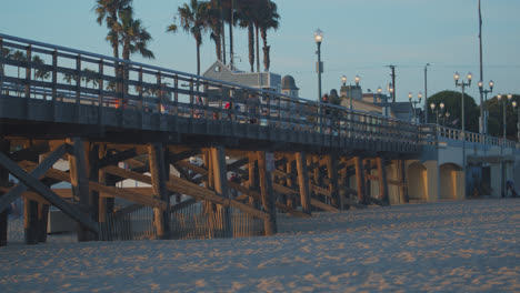 People-on-the-Seal-Beach-pier.-at-dusk
