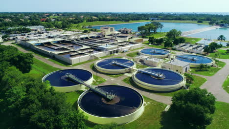 Static-hovering-aerial-view-of-a-waterfront-water-treatment-plant