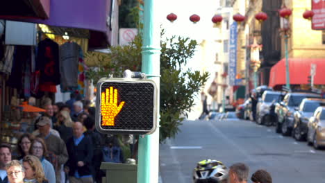 Crosswalk-sign-on-street-corner-in-Chinatown,-San-Francisco,-California