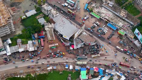 Roundabout-Traffic-Near-Rupatoli-Bus-Terminal-And-Slum-Area-In-Barisal-City,-Bangladesh