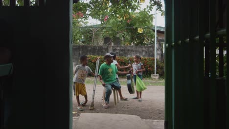 Carollers-finished-their-song-and-move-on-to-the-next-house-on-a-quiet-suburbs-in-Cadiz-City,-Negros-Occidental,-Philippines