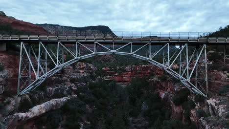 Flying-Under-The-Midgley-Bridge-Over-Wilson-Canyon-To-The-Viewpoint-In-Sedona,-Arizona,-USA