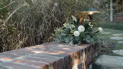 Brides-Bouquet-Sitting-on-a-Wall-with-Beautiful-White-Flowers