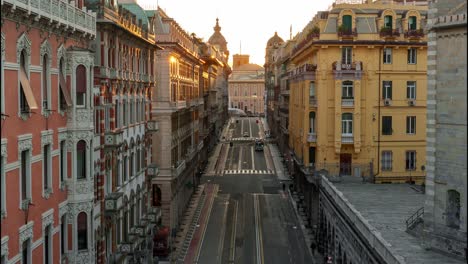 Sunset-timelapse-over-the-bustling-streets-of-central-Genoa,-capturing-the-dynamic-city-life-and-architectural-beauty